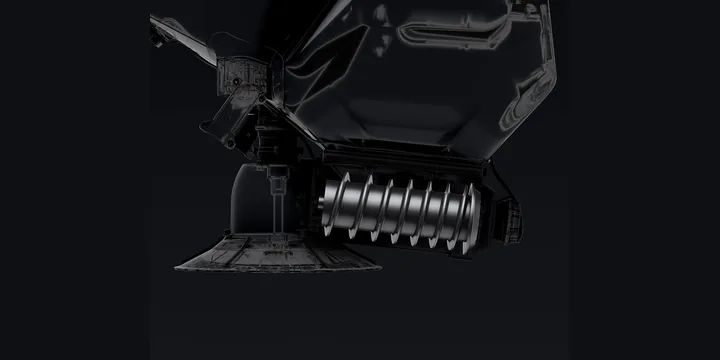The auger of a DJI spreading system above a bed of granules
