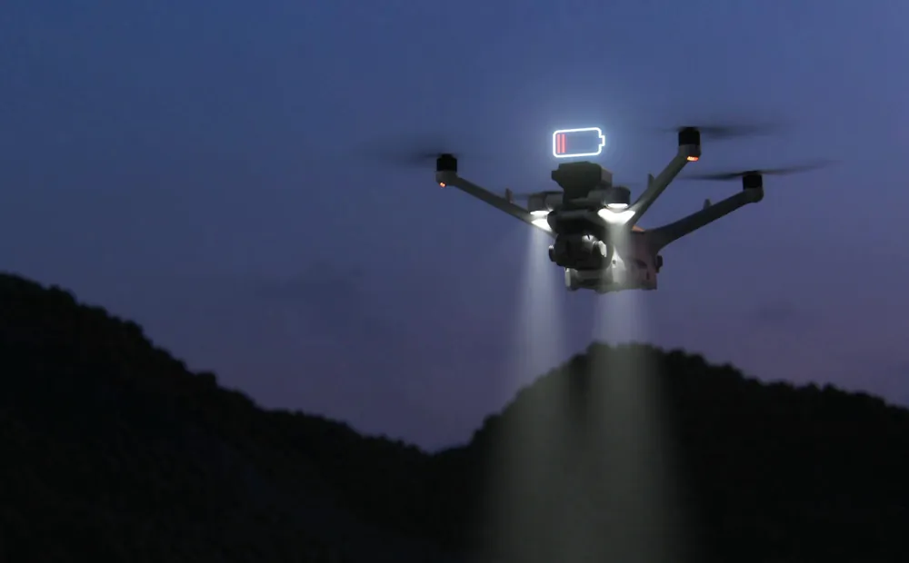 A drone returning to its dock at dusk with its lights on