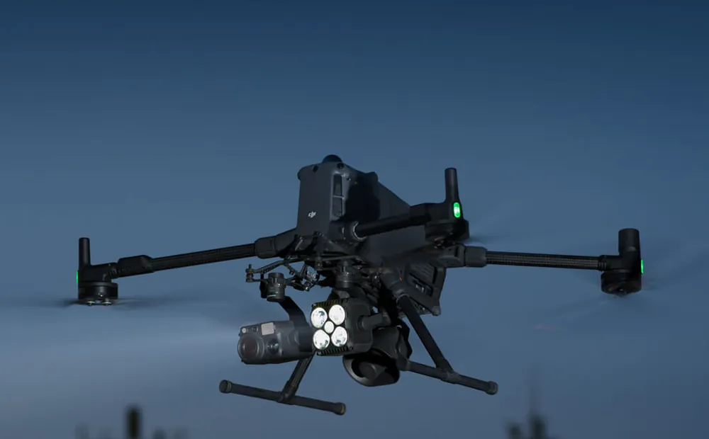 DJI Matrice 400 in flight with a payload fitted under the airframe