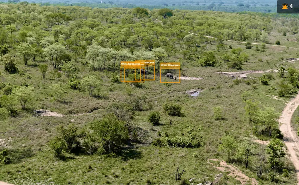 Aerial view from a DJI Matrice 4 over bushveld with a site marked below