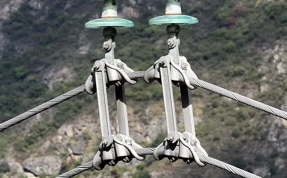 Two DJI Matrice 4 aircraft inspecting a high-voltage transmission line