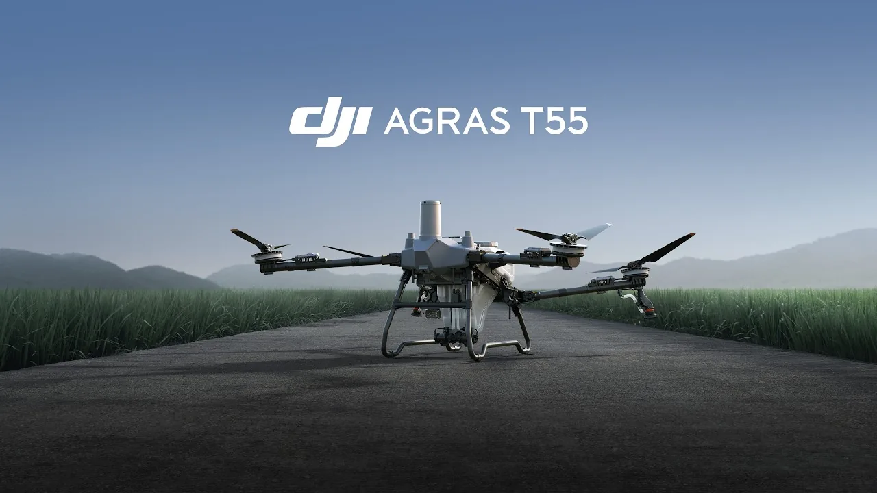DJI Agras T55 standing on a farm road beside sugar cane